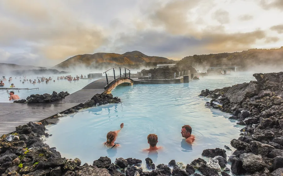 Bathers in the milky blue water of the Blue Lagoon