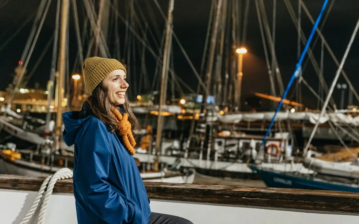 A boat leaving Reykjavik harbour at night